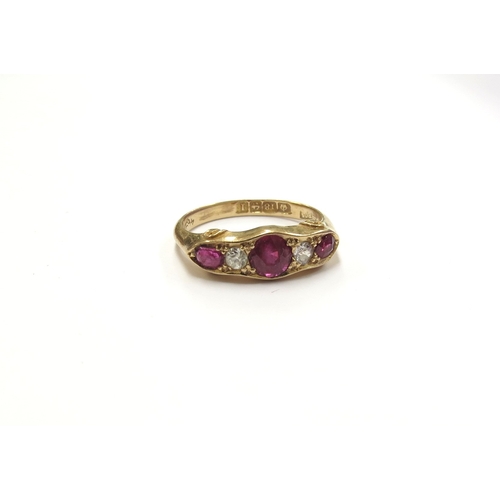 6030 - An 18ct gold five stone ruby and diamond ring, Birmingham. Size N, 3.5g