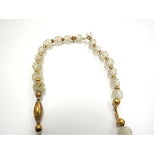 6418 - A Victorian woven hair bead necklace with woven triple bow hung with three heart shape drops, unmark... 