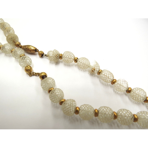 6418 - A Victorian woven hair bead necklace with woven triple bow hung with three heart shape drops, unmark... 