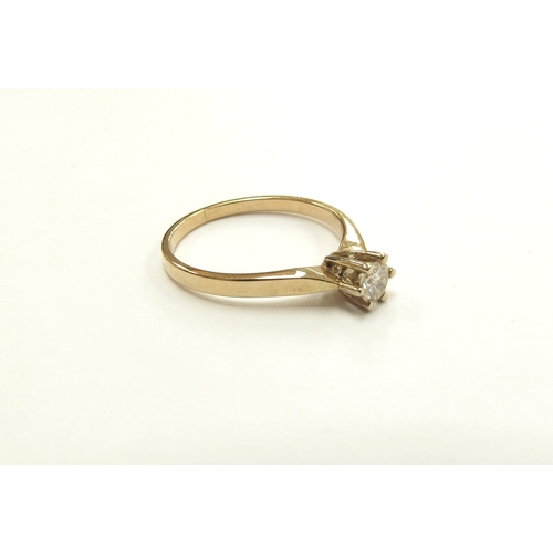 6309 - A diamond solitaire 0.18ct approx, shank stamped 585. Size J/K, 1.7g