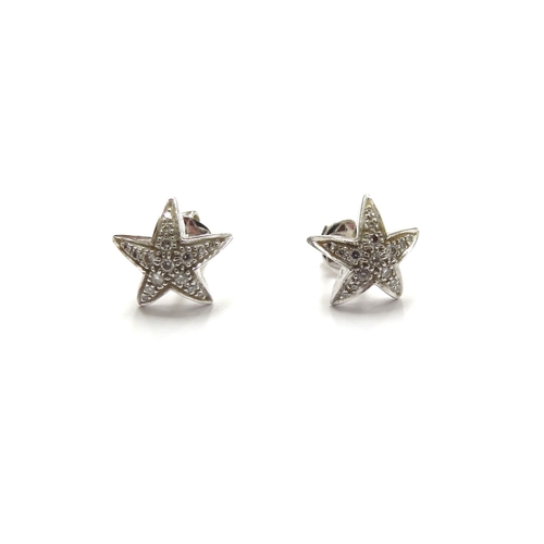 6017 - A pair of 18ct white gold diamond studded 