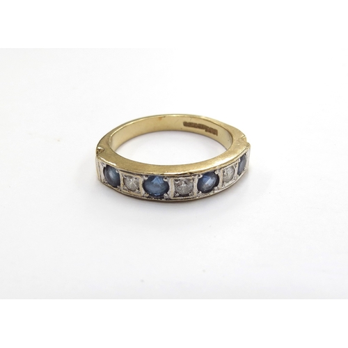 6010 - An 18ct gold seven stone sapphire and diamond half hoop ring. Size P/Q, 5.3g