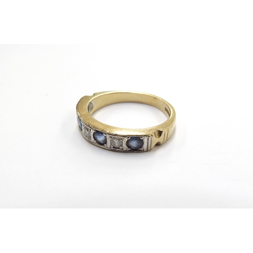 6010 - An 18ct gold seven stone sapphire and diamond half hoop ring. Size P/Q, 5.3g