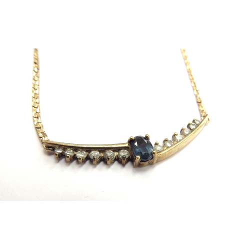 6088 - A 9ct gold necklace with centre panel with oval sapphire flanked by a row of graduated diamonds, 45c... 