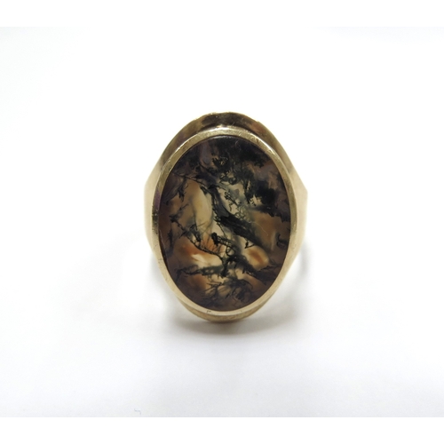 6028 - A 9ct gold ring with a large oval moss agate. Size R/S, 8g