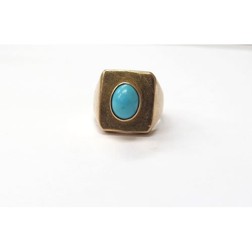 6026 - A gold ring circa 1970 set with a single turquoise cabochon, outside shank marked 750. Size O, 9.1g