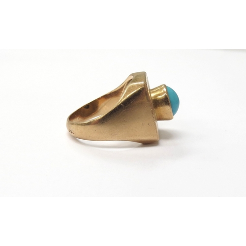 6026 - A gold ring circa 1970 set with a single turquoise cabochon, outside shank marked 750. Size O, 9.1g