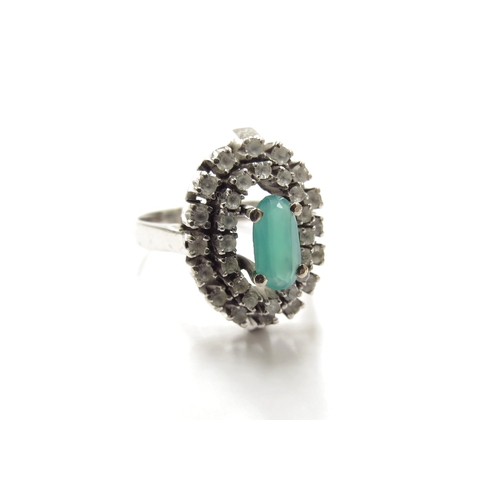 6161 - A white gold emerald and clear stone cluster ring. Size P, 6.4g