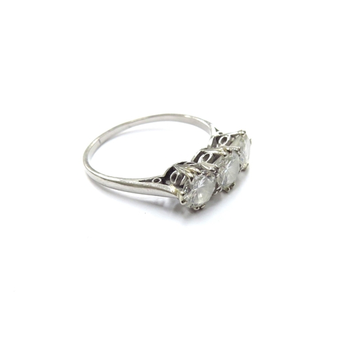 6135 - A platinum three stone diamond ring 1.80ct total approx. Size R, 3.7g