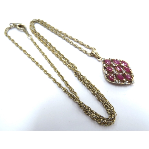 6077 - A 9ct gold diamond and ruby cluster pendant, 2.5g hung on metal chain