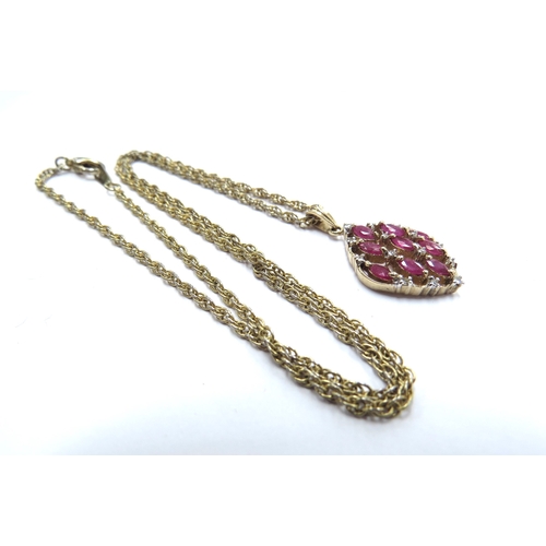 6077 - A 9ct gold diamond and ruby cluster pendant, 2.5g hung on metal chain