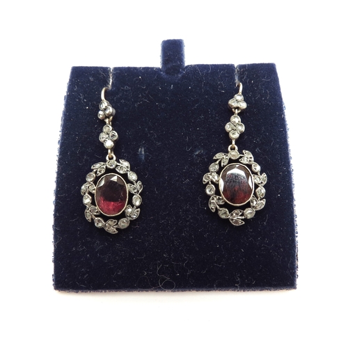 6004 - A pair of Edwardian old cut diamond and garnet drop earrings, 3.5cm drop, 3.2g