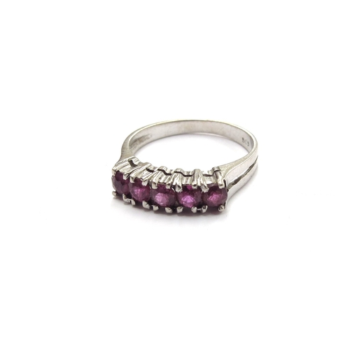 6330 - A white gold five stone ruby ring, stamped 585. Size N, 2.5g