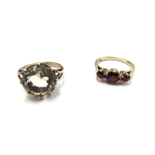 6075 - A 9ct gold citrine ring, size L and a gold three stone garnet ring stamped 9k, size M, 6.2g