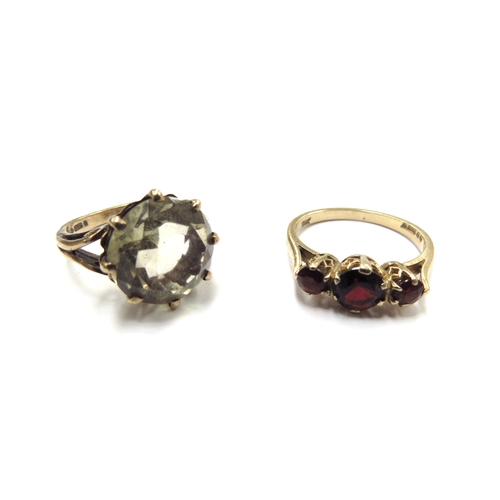 6075 - A 9ct gold citrine ring, size L and a gold three stone garnet ring stamped 9k, size M, 6.2g