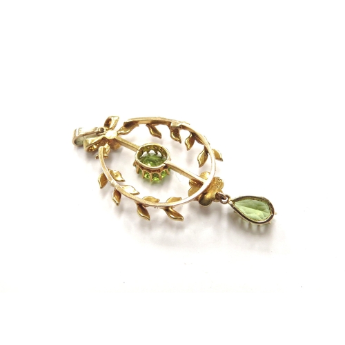 6128 - An Edwardian pearl and peridot drop pendant, stamped 15ct, 4.5cm long, 3.9g