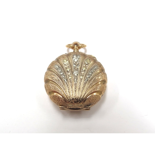 6123 - A ladies gold fob watch as a shell, engraved detail, stamped 18k, 21.4g total