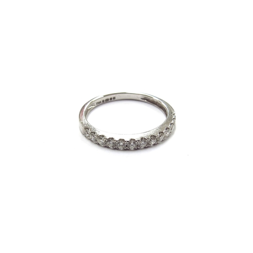 6033 - An 18ct white gold half hoop diamond eternity ring. Size N/O, 2g