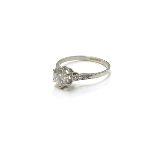 6132 - A platinum set diamond solitaire ring, 0.75ct approx flanked by diamond set shoulders. Size N, 2.3g