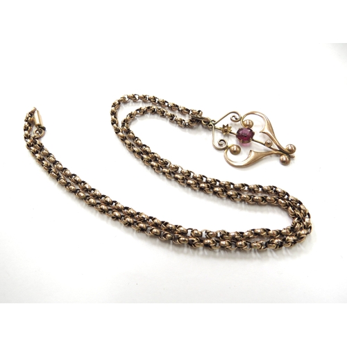 6046 - An Edwardian gold pendant centrally set with single garnet, stamped 9ct hung on a gold belcher chain... 