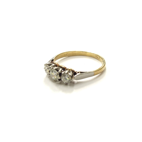 6259 - A three stone diamond ring, 0.48ct approx total, stamped 18ct. Size N, 2.2g