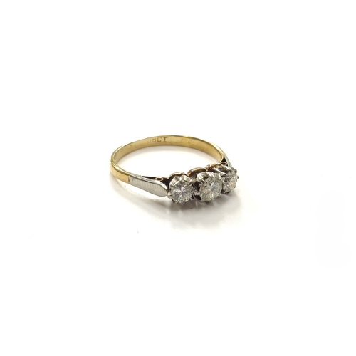 6259 - A three stone diamond ring, 0.48ct approx total, stamped 18ct. Size N, 2.2g