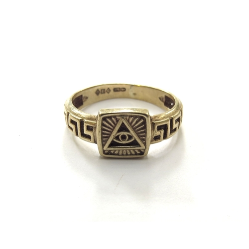 6093 - A 9ct gold ring with the magic eye symbol, Greek key patterned band. Size Q, 3.1g