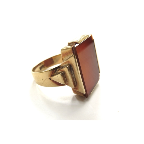 6332 - A gents gold ring set with a large cornelian panel in stepped mount, stamped 585. Size Y, 12.8g