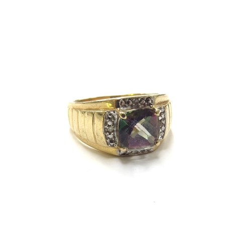 6170 - A gents gold ring set with a facet cut mystic topaz framed by diamonds, stamped 10k. Size V, 6.5g