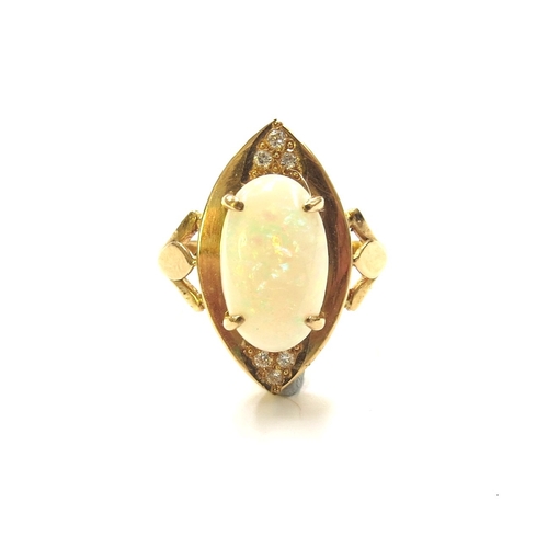 6260 - A gold ring with central oval opal in four claws raised on a wide lozenge outer, set north and south... 