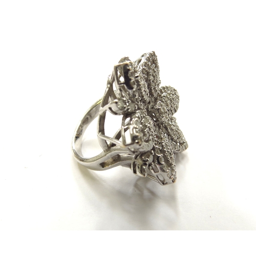 6172 - A white gold large diamond cluster floral ring, 2.6cm diameter, stamped 750. Size K, 11.7g