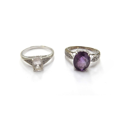 6109 - Two 9ct white gold rings amethyst and clear stone with diamond chip shoulders, sizes K and N/O, 5.9g