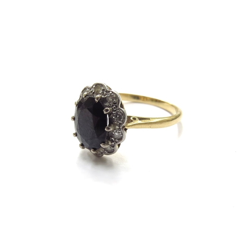 6320 - A gold sapphire and diamond cluster ring, marked 18ct, rubbed. Size O, 3.9g