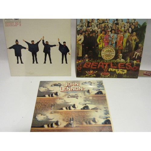 1025 - The Beatles - two vinyl LP records to include 'Help!' (PCS 3071) and 'Sgt. Pepper's Lonely Hearts Cl... 