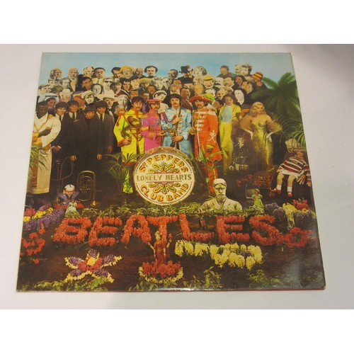 1025 - The Beatles - two vinyl LP records to include 'Help!' (PCS 3071) and 'Sgt. Pepper's Lonely Hearts Cl... 