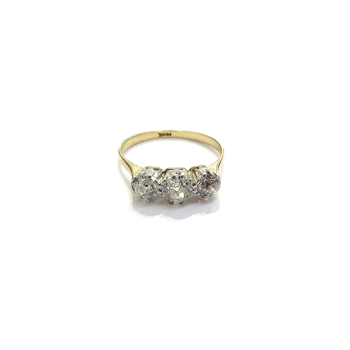 6023 - A three stone diamond ring, 0.70ct total approx, stamped 18ct. Size R, 2.8g