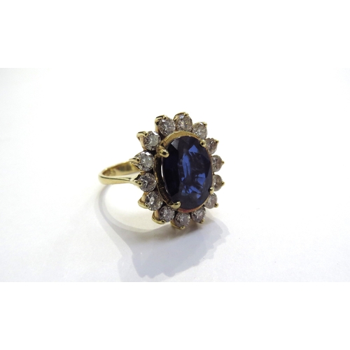 6034 - A sapphire and diamond cluster ring the central oval sapphire 11.5mm x 8.5mm, 3.47ct approx set in f... 