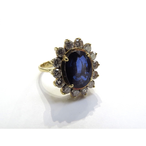 6034 - A sapphire and diamond cluster ring the central oval sapphire 11.5mm x 8.5mm, 3.47ct approx set in f... 