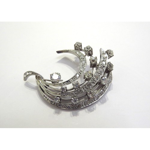 6152 - A platinum diamond encrusted brooch of stylised form, 3.50ct total approx diamonds, 5cm x 4.2cm, 18.... 