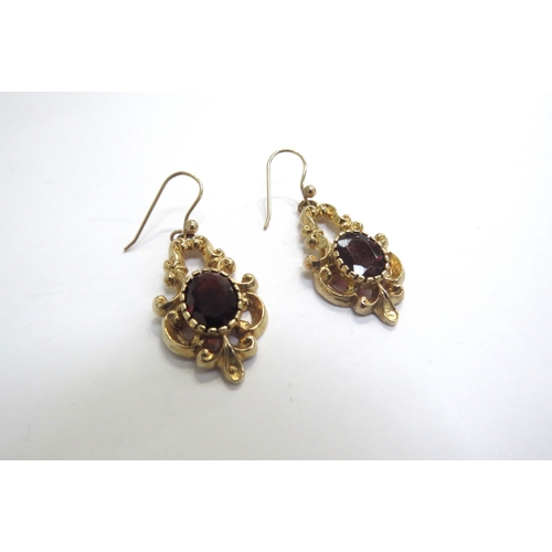 6175 - A pair of 9ct gold ornate garnet drop earrings, 3.5cm drop, 9.1g