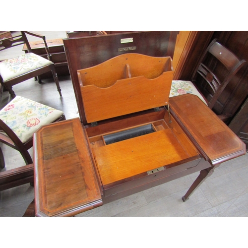 1140 - An Edwardian mahogany and satin wood strung fold top writing table 