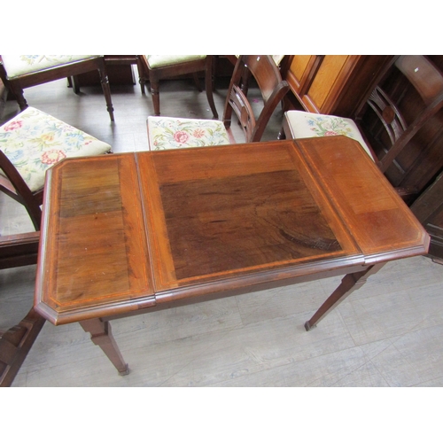 1140 - An Edwardian mahogany and satin wood strung fold top writing table 