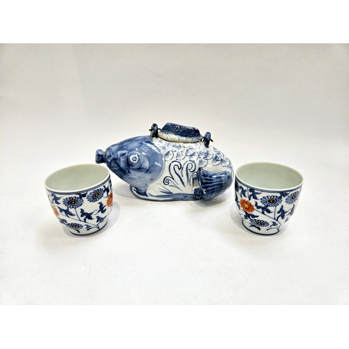 1189 - A Japanese fish teapot and two cups with chrysanthemum decoration, blue four character mark to base ... 