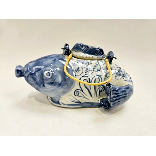 1189 - A Japanese fish teapot and two cups with chrysanthemum decoration, blue four character mark to base ... 