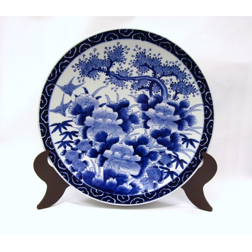 1206 - A Japanese Arita charger, the deep blue cloud pattern border surrounding a wildlife image of birds, ... 