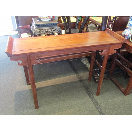 1207 - A Chinese hardwood alter table with shaped frieze, 90cm tall x 128cm long x 39cm wide