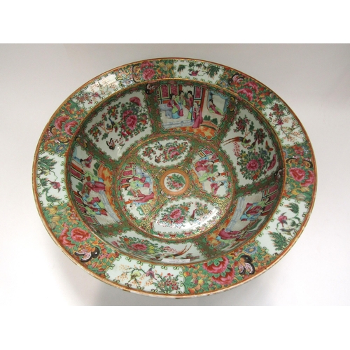 1212 - A late 19th Century highly ornate Canton flared rimmed bowl, the interior with multiple figural and ... 