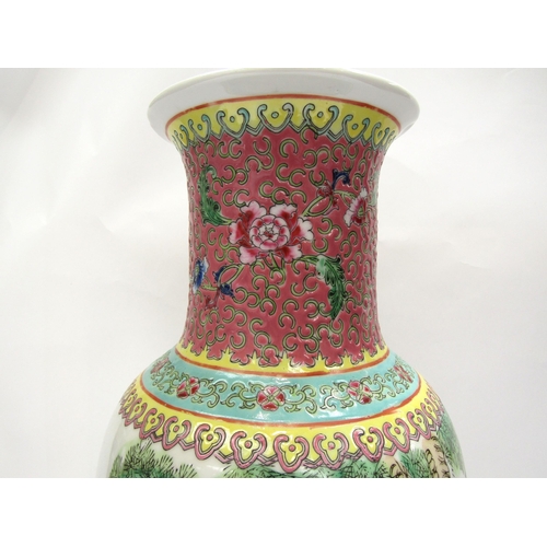 1215 - A 20th Century famille rose vase with repeating floral border above a figural landscape frieze depic... 