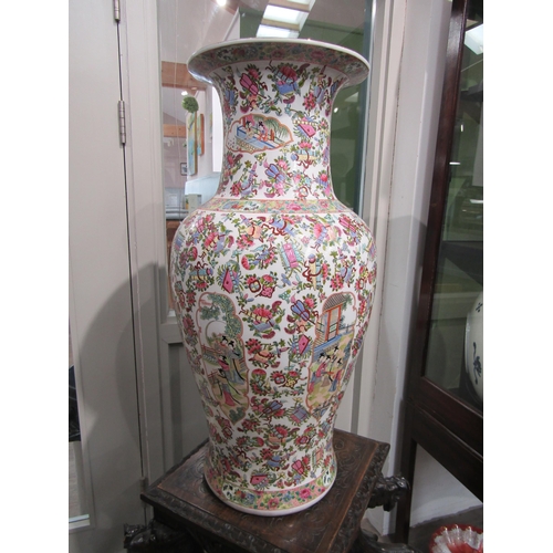 1220 - A 20th Century large Canton floor vase with all-over enamel decoration and figural cartouches, 78cm ... 