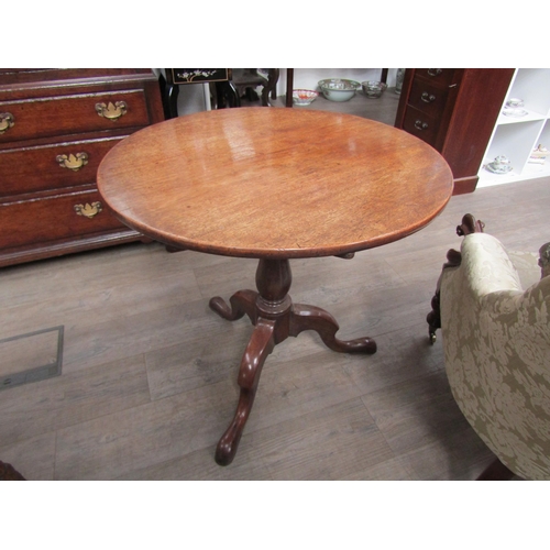 1252 - A George III mahogany tilt-top tripod table, on tripod form base, 71cm tall x 74cm diameter